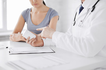 Image showing patient and doctor prescribing medication