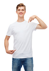 Image showing smiling young man in blank white t-shirt