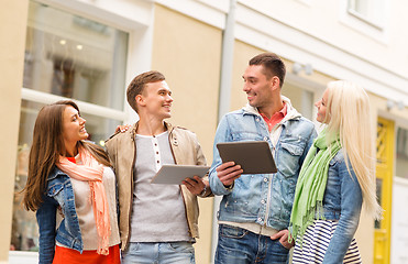 Image showing group of smiling friends with tablet pc computers