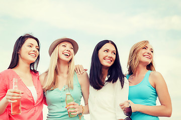 Image showing girls with drinks on the beach