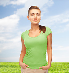 Image showing smiling young woman in blank green t-shirt