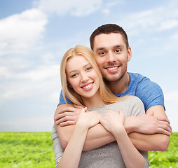 Image showing smiling couple hugging