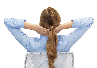 Image showing businesswoman sitting on chair from back