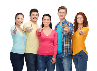Image showing group of smiling teenagers showing thumbs up