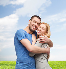 Image showing smiling couple hugging