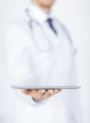 Image showing male doctor holding tablet pc