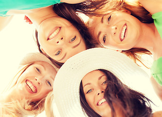 Image showing faces of girls looking down and smiling