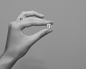 Image showing woman holding dice