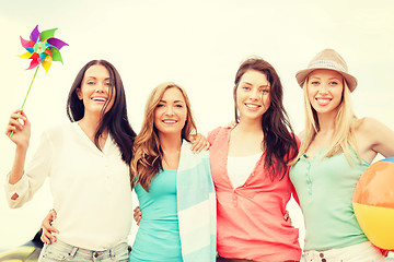 Image showing smiling girls having fun on the beach