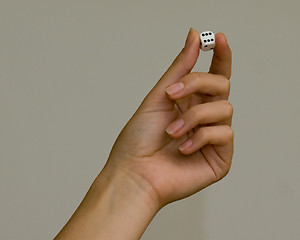 Image showing woman holding dice