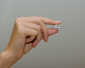 Image showing woman holding dice