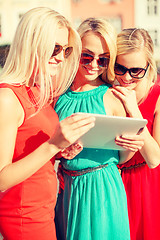 Image showing beautiful girls toursits looking into tablet pc