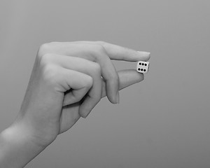 Image showing woman holding dice