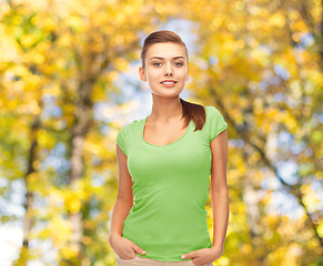 Image showing smiling young woman in blank green t-shirt