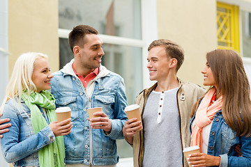 Image showing group of smiling friends with take away coffee