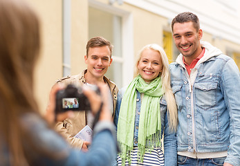 Image showing group of smiling friends taking photo outdoors