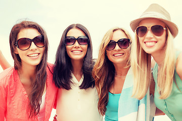 Image showing girls in shades having fun on the beach