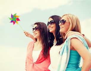 Image showing girls with windmill toy on the beach