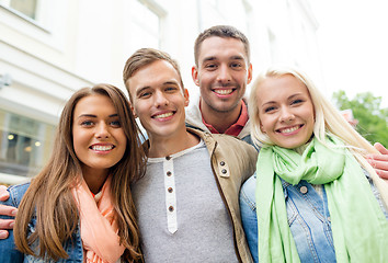 Image showing group of smiling friends in city