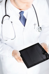 Image showing male doctor holding tablet pc