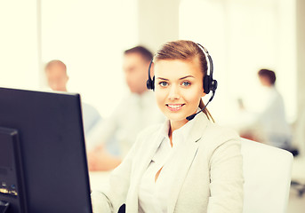 Image showing helpline operator with headphones in call centre