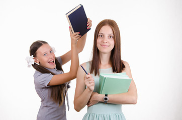 Image showing Trainee teacher has a textbook