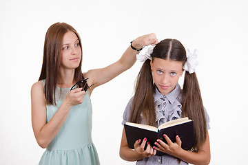 Image showing Teacher student knocks on the head