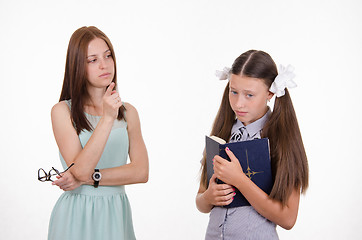 Image showing The teacher shakes his finger at the student