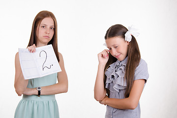 Image showing Schoolgirl crying because of two received