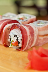 Image showing Sushi roll with bacon