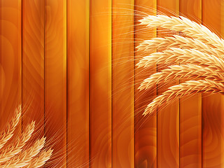 Image showing Wheat on wooden autumn background. EPS 10