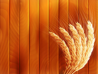 Image showing Wheat on wooden autumn background. EPS 10