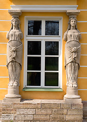 Image showing window with sculptures