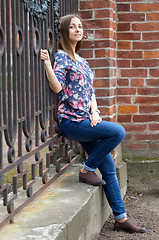 Image showing Full-length portrait of a pensive girl.