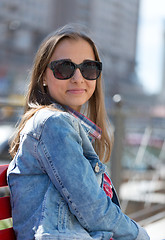 Image showing Young beautiful stylish girl smiling on a sunny day