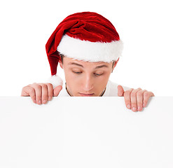 Image showing Young man in Santa hat