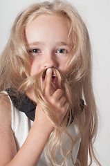 Image showing Little girl with long hair fooling around