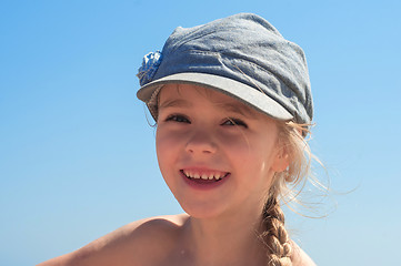 Image showing Adorable happy little girl in denim cap