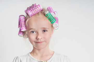 Image showing Adorable child girl portrait in curlers
