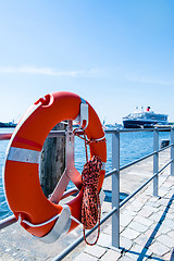 Image showing Red Lifebuoy in front of cruise ship