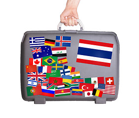 Image showing Used plastic suitcase with stickers