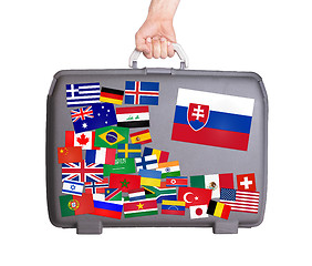 Image showing Used plastic suitcase with stickers