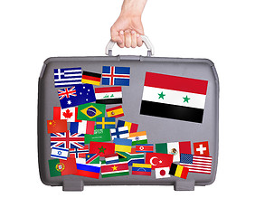 Image showing Used plastic suitcase with stickers