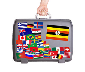 Image showing Used plastic suitcase with stickers