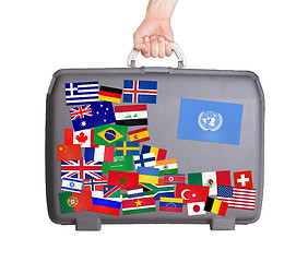 Image showing Used plastic suitcase with stickers