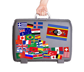 Image showing Used plastic suitcase with stickers