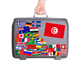 Image showing Used plastic suitcase with stickers