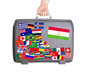 Image showing Used plastic suitcase with stickers