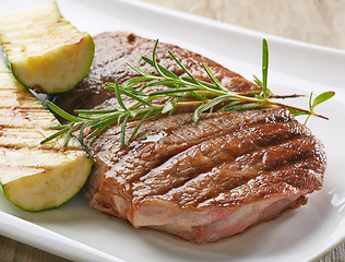 Image showing grilled beef steak and zucchini