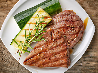 Image showing grilled beef steak on white plate